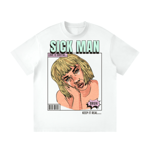 A white short-sleeve crewneck t-shirt featuring a graphic print of a cartoon-style blonde woman with the text 'SICK MAN' above her and 'KEEP IT REAL' below, on a plain white background.