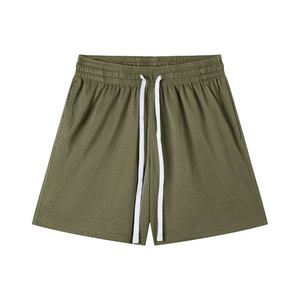 Green shorts with white drawstring on a white background