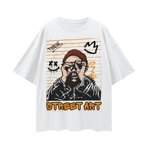White t-shirt with street art design featuring a graphic of a person with a crown and text on a white background.