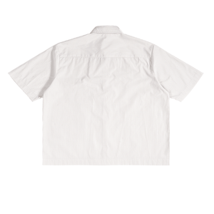 White short-sleeve shirt with subtle pattern on a white background