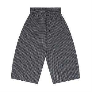 Black and white checkered pants on a white background