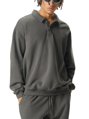 Person wearing a gray long-sleeve shirt and pants on a white background