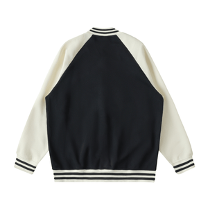 Black and white varsity jacket on a white background