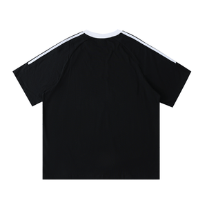 Black t-shirt with white stripes on shoulders against a white background