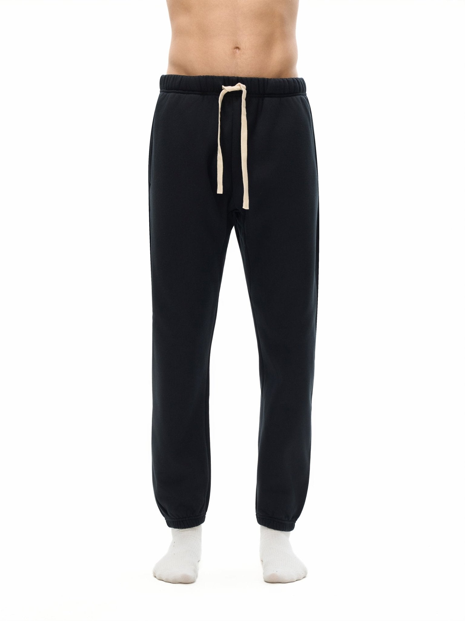 Black sweatpants with a drawstring on a white background