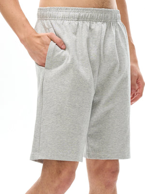 Gray shorts worn by a person on a white background