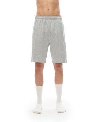 Person wearing gray shorts on a white background