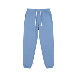 Light blue sweatpants with a drawstring on a white background