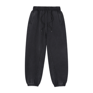 Black sweatpants with drawstring on a white background