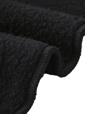 Close-up of dark gray fabric with a textured pattern on a white background