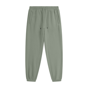 Green jogger pants on a white background
