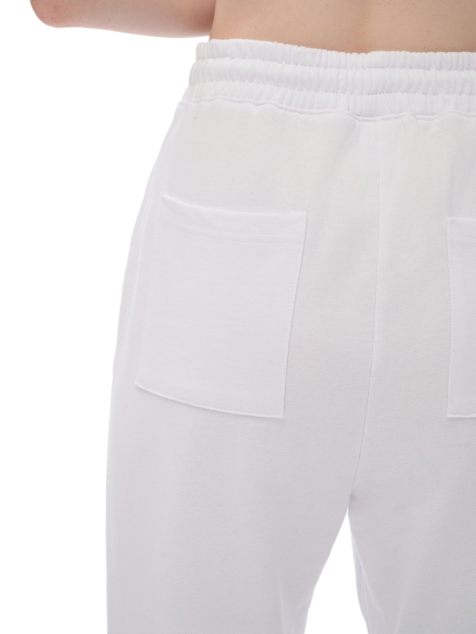 White pants with a pocket detail on a white background