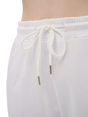 White sweatpants with drawstring and brand logo on a white background