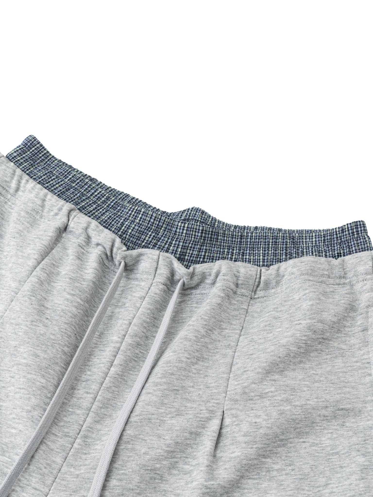 Gray sweatpants with blue waistband on a white background