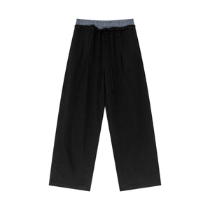 Black wide-leg pants with a checkered waistband on a white background