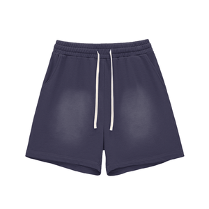 Navy blue shorts with a white drawstring on a white background
