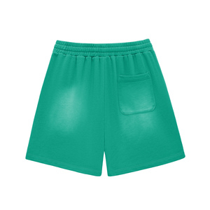 Green shorts with a pocket on a white background