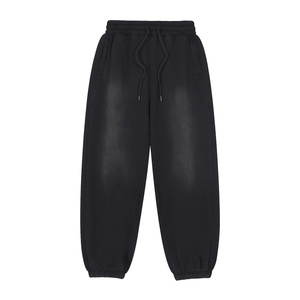 Black leather jogger pants on a white background