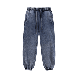 Blue denim jogger pants on a white background