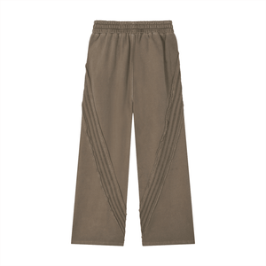 Brown pants with pleated sides on a white background