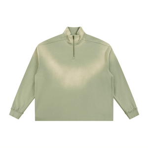 Light green long-sleeve shirt with a quarter zip on a white background