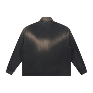 Black leather jacket shown from the back on a white background