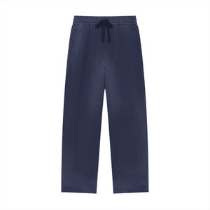 Navy blue pants with a drawstring on a white background