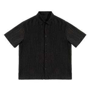 Black pleated short-sleeve shirt on a white background