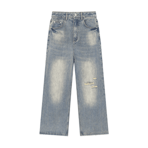 Distressed blue jeans on a white background