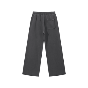 Dark gray pants with a pocket on a white background