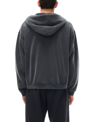 Person wearing a gray hoodie from behind on a white background
